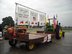 Carl Raatz drove the lead tractor and pulled the advertising wagon that was created by Alten Farms