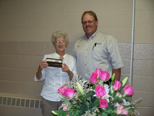 McHenry County Farm Bureau President Bruce Meier presents Marion Spiniolas with a token of appreciation for her years of service and dedication to the Women's Committee!